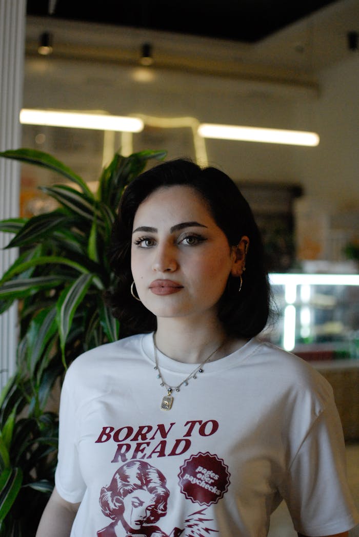 confident-woman-in-stylish-t-shirt-indoors-32010304